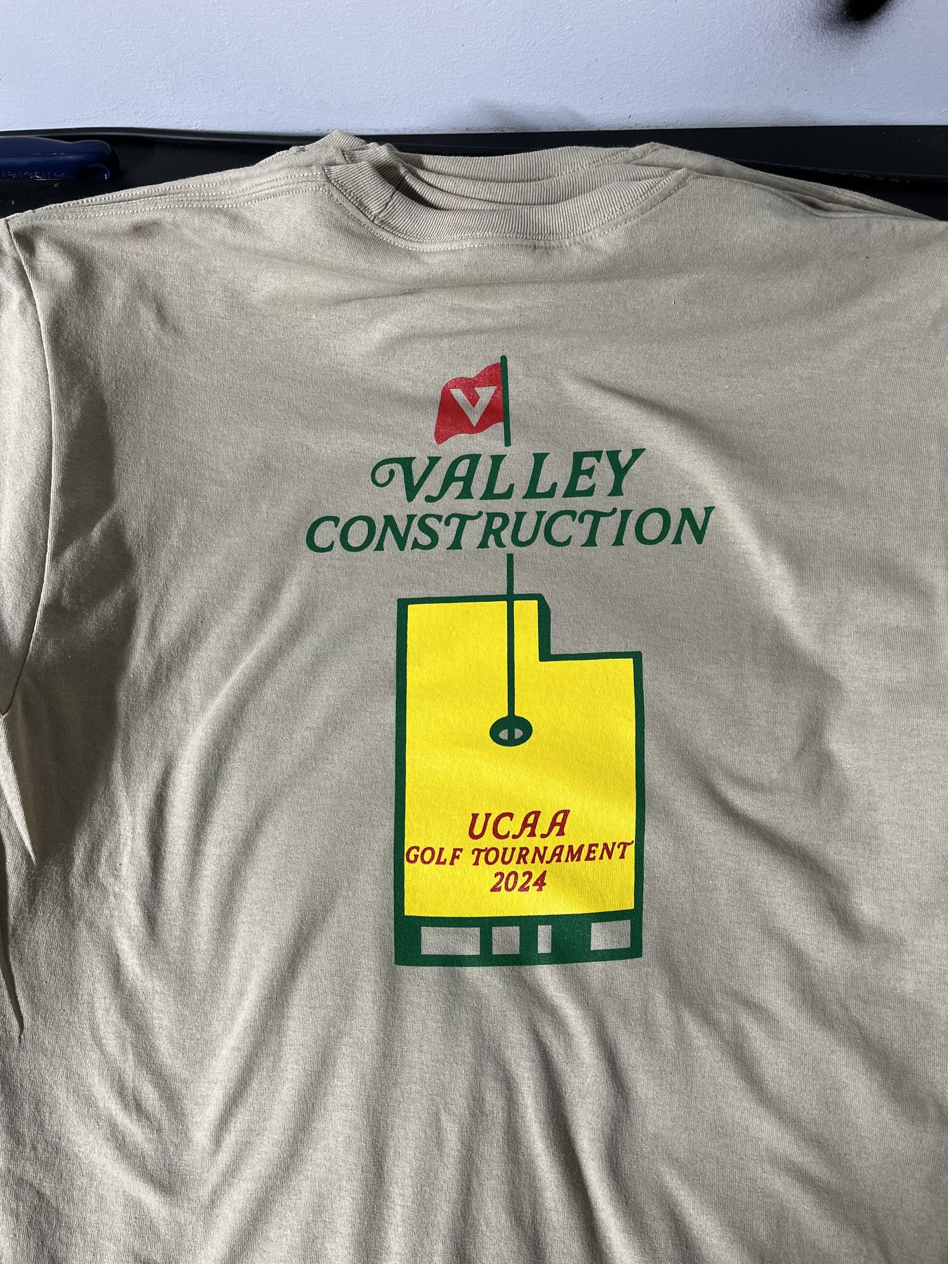 Valley Construction golf-tournament graphic printed on a light shirt